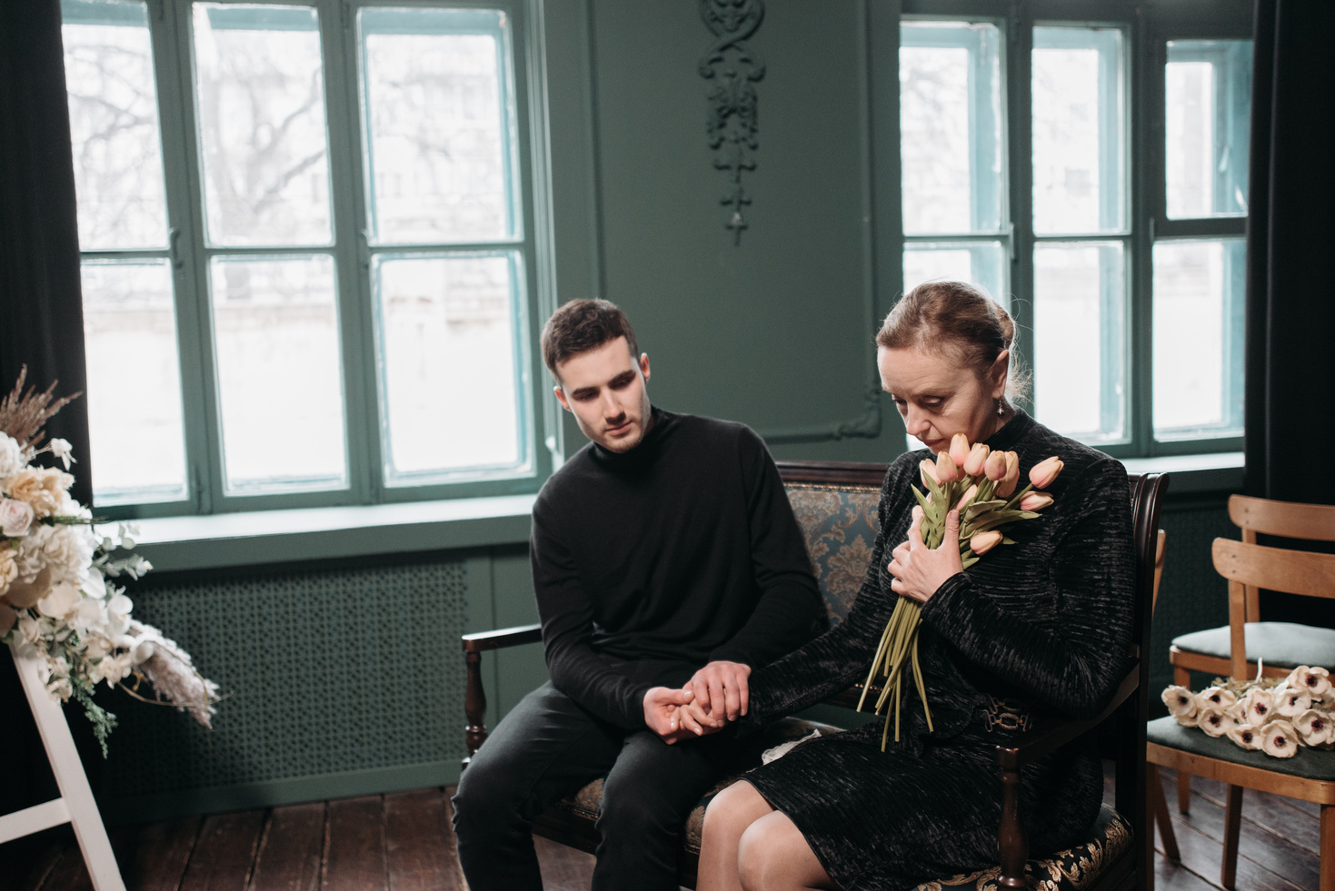 A Bereaved Mother and Son in a Funeral Service